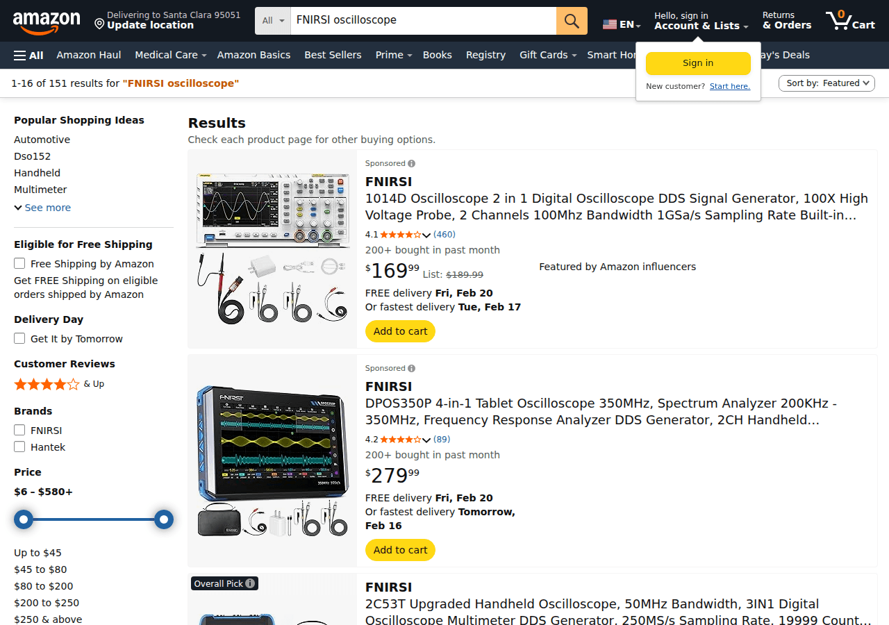 FNIRSI 1014D budget oscilloscope and signal generator combo on a hobbyist electronics bench